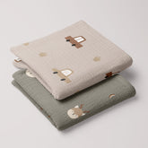 Folded set of baby muslin swaddles in Cars and Forest Deer prints